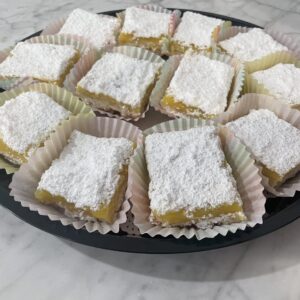Nothing prepares you for that intense, wonderful sweet-tart flavor and custard that is joined against the crisp, sweet buttery shortbread cookie. Pucker-Up for these mouth-watering lemon bars that come twelve (12) in a box.
